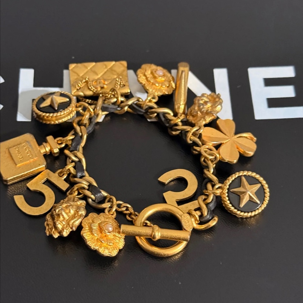 CHANEL Gold Charm Bracelet with Iconic Symbols